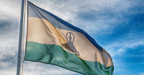 Low angle view of flag against sky