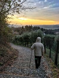 Rear view of a woman walking on landscape