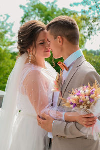 Couple holding flower bouquet