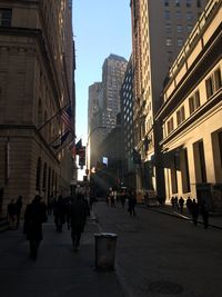People walking on street in city