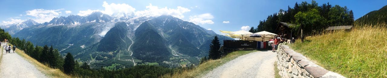 Panoramic view of road amidst mountains against sky