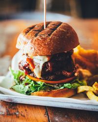 Close-up of hamburger in plate on table