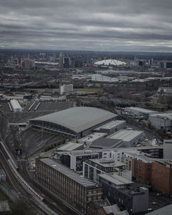 High angle view of cityscape against cloudy sky