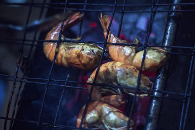 Close-up of shrimps on barbecue grill