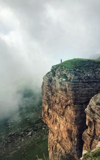 Rock formations on mountain against sky