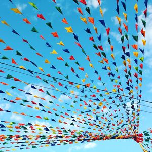 Low angle view of colorful bunting against sky