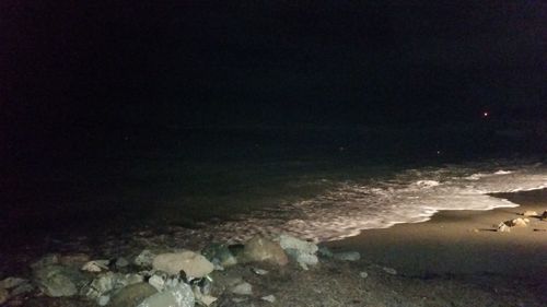 Close-up of sea against sky at night