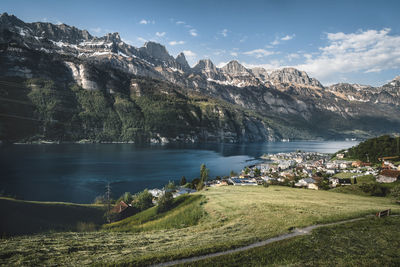 Scenic view of lake and mountains against sky