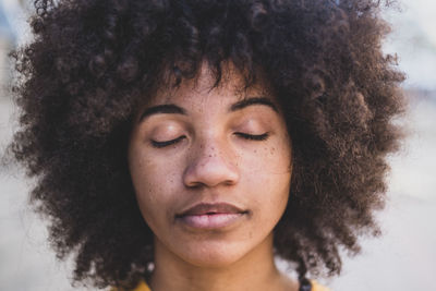 Close-up of woman with eyes closed