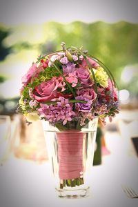 Close-up of pink roses in vase on table