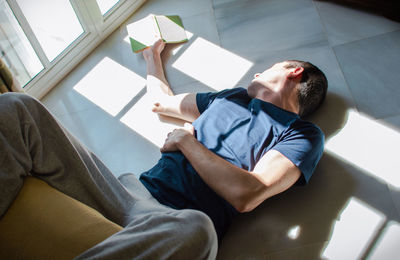 High angle view of man sitting at home