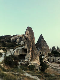 Low angle view of rock formation against clear sky