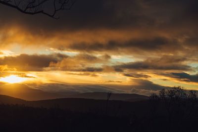 Scenic view of dramatic sky during sunset