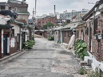 Narrow alley amidst buildings in town