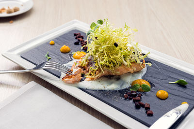 High angle view of vegetables in plate on table