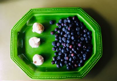 High angle view of fruits in plate on table