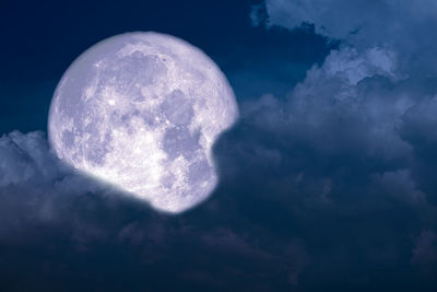 Low angle view of moon against sky at night