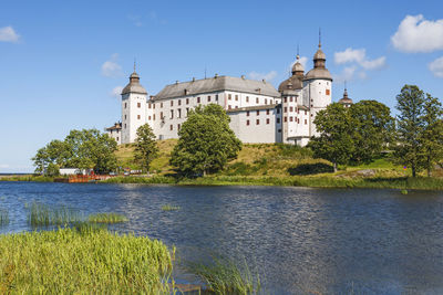 Lacko castle on a hill by a lake vanern