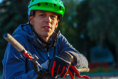 Portrait of man wearing cycling helmet