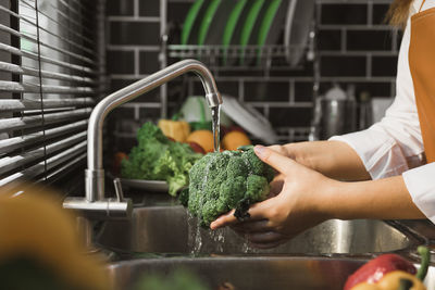 Midsection of woman holding food