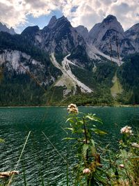 Scenic view of lake and mountains against sky