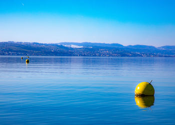 Scenic view of sea against blue sky