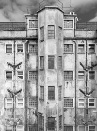 Low angle view of old building against sky