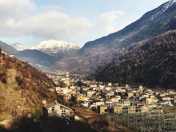 High angle view of townscape and mountains against sky