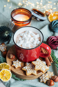 Cozy winter and christmas setting with hot cocoa and homemade cookies