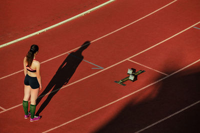 Woman standing on tracks