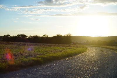 Scenic view of field against sky during sunset