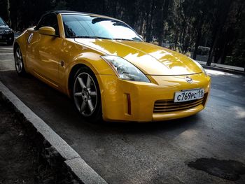 Yellow car on road