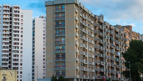 Low angle view of modern buildings against sky