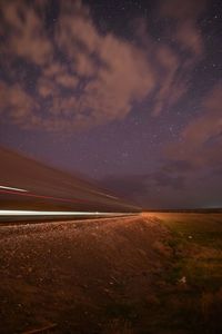 Scenic view of landscape against sky at night