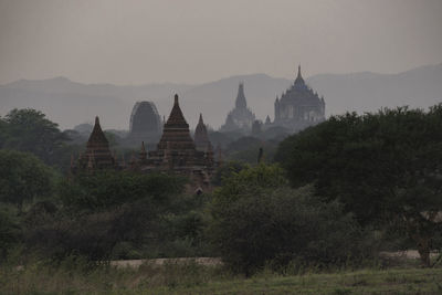 Temple against sky at sunset