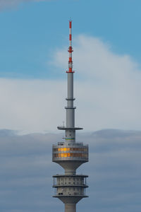 Low angle view of communications tower against sky