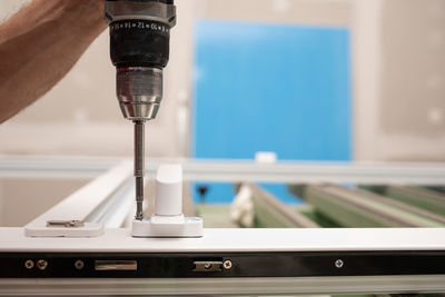 Close-up of hand holding machine