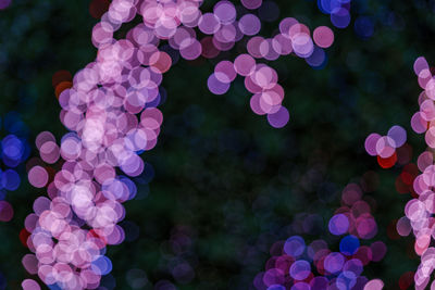 Defocused image of illuminated lights at night