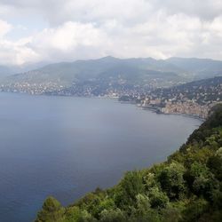 High angle view of townscape by sea against sky