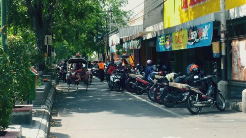 Bicycles on street amidst buildings in city