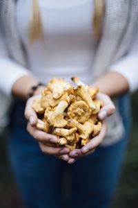 Woman holding chanterelles