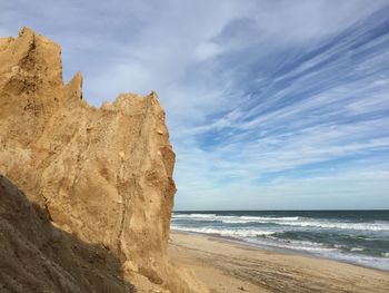 Scenic view of beach against sky