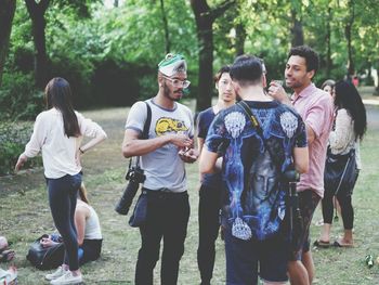 Friends standing in park