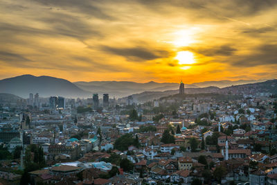 Cityscape against sky during sunset