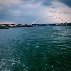 Bridge over sea against sky