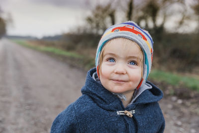 Portrait of cute girl in warm clothes