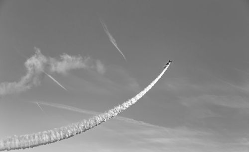 Low angle view of vapor trail against sky