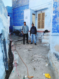 People standing on wall of building