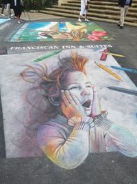 High angle view of painting on street in city
