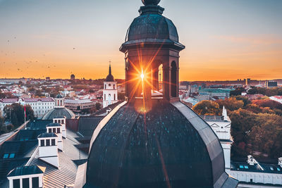 Aerial view of townscape against sky during sunset